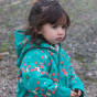 A young child wears the LGR Forest Walk Sherpa Fleece Snowsuit in an outdoor setting.