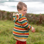 A child wears the LGR Rainbow Striped Knitted Hooded Cardigan in an outdoor setting.