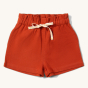 Soft Red By The Sea Twill Shorts. Made from GOTS Organic Cotton, these shorts have a white and yellow drawstring, and paperbag waist