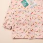 Close up of the LGR eco-friendly recycled kids pink jacket showing the origami birds pattern on a white background