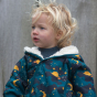 A young child wears the LGR Saturn Nights Sherpa Fleece Snowsuit in an outdoor setting.