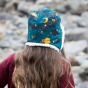 A child wears the LGR Saturn Nights Sherpa Hat in an outdoor setting.