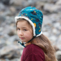 A child wears the LGR Saturn Nights Sherpa Hat in an outdoor setting.