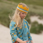 Close up of young girl wearing the blue knitted organic cotton LGR sunshine cardigan