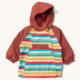 Little Green Radicals Rainbow Striped Recycled Waterproof Windbreaker Jacket. A cosy waterproof and windproof jacket with rainbow stripes, a pocket, zip and popper fasteners on the front, with a burgundy hood and arms 
