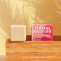 Picture of the Lamazuna soothing facial cleanser with its pink box, on a wooden box.