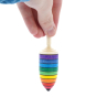 Close up of a hand holding the Mader wooden rainbow thunderbolt spinning top on a white background