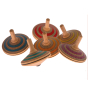 Multiple different coloured Mader Fado Maple Spinning Tops against a plain background.