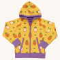 Maxomorra Children's Organic Cotton Pineapple Reversible Hoodie. A bright, yellow fabric with whole and half pineapple repeat print, purple piping on the hood and pockets, a purple zip, and thick purple cuffs and waistband, with a solid purple reversible 