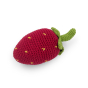 Myum organic cotton crochet strawberry rattle toy laid down on a white background