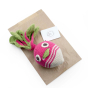 Myum plastic free fairtrade soft vegetable toy on a brown paper bag on a white background