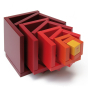 Naef Cella Stacking Cube in a red colour shown with pieces pulled apart pictured on a plain background 