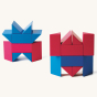 Naef premium wooden Ponte stacking toy blocks, piled in two geometric shapes on a beige background
