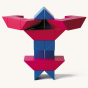 Red and blue Naef ponte toy blocks stacked in a geometric tower on a beige background