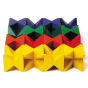 Naef Spiel stacking blocks lined up in 4 coloured rows on a white background