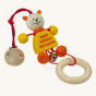 Nic plastic-free wooden cat pram toy laid out on a beige background