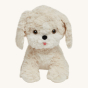 The Olli Ella Dinkum Dog "Cookie" is a dog shaped stuffed toy with soft cream coloured fur, a cute round face, and long floppy ears.
