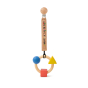 Oli & Carol X Bauhaus Movement Teething Ring placed on a cotton safety strap pictured on a plain white background 