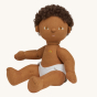 Olli Ella Button poseable, soft bodied, curly haired, Dinkum Doll with no romper on, wearing a white nappy siting down pictured on a plain coloured background 