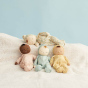 4 Olli Ella daydream collection dozy dinkum dolls laying on a white blanket in front of a white background