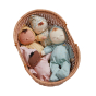 Olli Ella childrens dozy dinkum toy dolls laying in a wicker basket on a white background