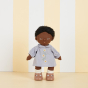 Olli Ella dinkum doll stood on a striped cream background wearing the cornflower blue daisy dress