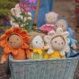 Olli Ella Dinky Dinkum Blossom Buds - Sunny Sunflower sat in an Ollie Ella wagon surrounded by the rest of the blossom bud range