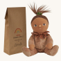 Olli Ella Dinky Dinkum Doll - Allie Acorn. The doll faces forward and sits next to its packaging.
