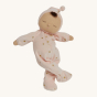 Olli Ella Lullaby Dozy Dinkum Doll - Luna is a posable baby doll with light brown skin, a tuft of brown hair, and a non-removable ballet pink soft velvet onesie with golden embroidered stars.
