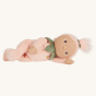 Olli ella pink dinky doll soft toy laying on a beige background