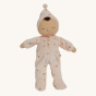 Olli Ella Lullaby Dozy Dinkum Doll - Luna is a baby doll with light brown skin, a tuft of brown hair, and a non-removable ballet pink soft velvet onesie with golden embroidered stars.