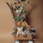 Olli Ella Wild Cozy Dinkum Dolls in a homemade cardboard tree placed in a pull along wagon 