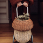 olli ella mushroom shaped basket with wheels with flowers inside