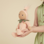 Close up of child holding an Olli ella soft dinky doll toy