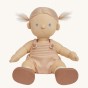 Olli Ella Pea poseable, soft bodied Dinkum Doll sitting down with their hair tied in bunches at the sides of their head pictured on a plain coloured background 