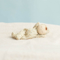 Olli ella eco-friendly soft dozy dinkum doll in the pickle blossom print on a white blanket