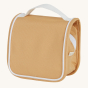Olli Ella See-Ya wash bag in a butterscotch yellow colour pictured on a plain background