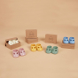 Olli ella dinkum doll toy shoe accessories laid out on a beige background in their boxes