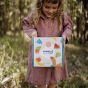 Image showing a child holding the Fantastic Fruit Tubbles Stones in their hands, to show the size of the box