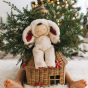 Cozy Dinkums Bunny Twiggy sitting on top of a festive basket