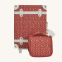 Olli Ella See-Ya Washbag in Sweetheart Red design, with small white flowers on a red fabric background, infront of Olli Ella Travel Case in same design