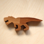 O-WOW eco-friendly Walnut T-Rex toy on a bright wooden background