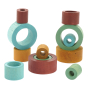 Papoose handmade coloured wooden earth nesting tubes stacked in random towers on a white background