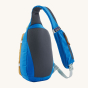 Patagonia Atom Sling 8L - Patchwork bag in Vessel Blue. Image shows the back of the bag with the strap pouch pocket