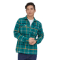 Patagonia Men's Long Sleeve Organic Cotton Fjord Flannel Shirt - Brisk green with front pockets and buttons down the front worn by a person wearing a white tshirt underneath and blue jeans on a white background