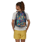 view of the back of a person wearing the Patagonia Atom Tote Pack 20L - Joy / Pitch Blue 