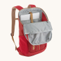 Patagonia Recycled Black Hole Backpack 25L in Touring Red with lid open showing the padded laptop sleeve pocket on a cream background  
