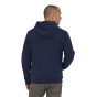Man stood backwards wearing the Patagonia eco-friendly ridge line logo hoody in new navy on a white background