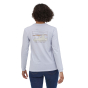Woman stood backwards wearing the Patagonia 73 skyline long sleeved top on a white background