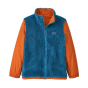 Thermal fleece side of the Patagonia kids 4 in 1 orange and blue jacket on a white background